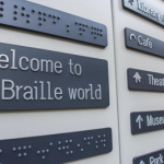 Braille and aluminium composite wayfinding signs installed on a commercial building in Melbourne